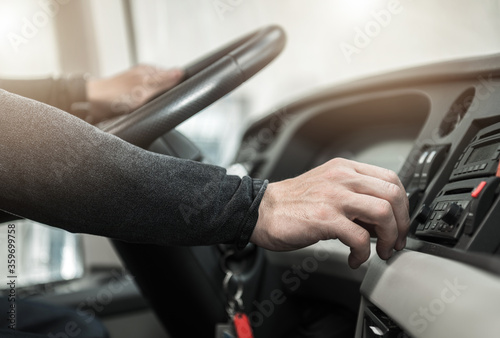 Coach Bus Driver Keeping Steering Wheel Close Up