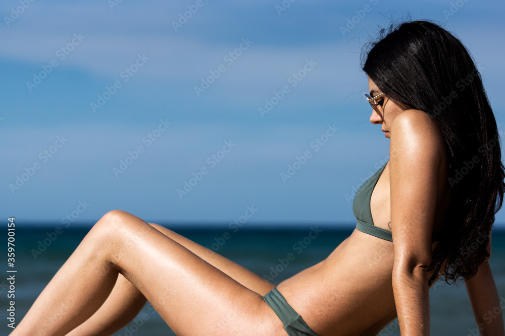 Nice girl with a green bikini having fun on the beach Nice girl with a green bikini having fun on the beach