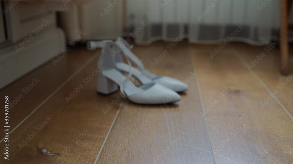 white shoes of the bride on the floor white shoes of the bride on the floor