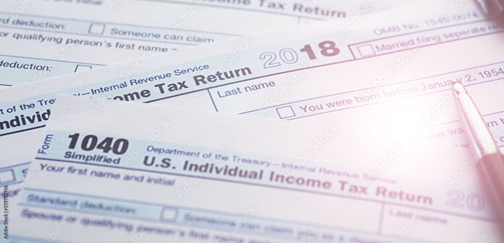 Annual tax reporting. Tax form on the table. Financial statements for signature. Annual tax reporting. Tax form on the table. Financial statements for signature.