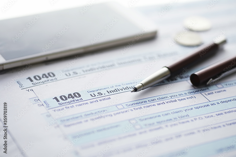 Annual tax reporting. Tax form on the table. Financial statements for signature. Annual tax reporting. Tax form on the table. Financial statements for signature.