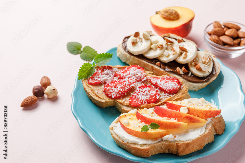 Sweet sandwiches with fruits and berries on pink colorful background. Sweet sandwiches with fruits and berries on pink colorful background.