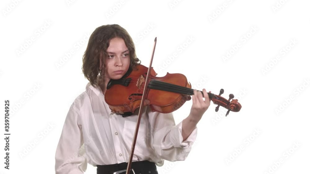 young violinist in a white blouse playing the classical violin. Isolated. Medium long shot young violinist in a white blouse playing the classical violin. Isolated. Medium long shot