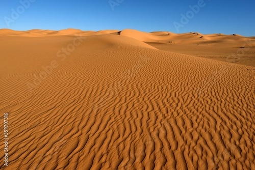 SAHARA DESERT SAND DUNES IN TASSILI NATIONAL PARK IN ALGERIA