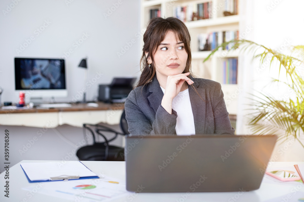 young businesswoman working on laptop young businesswoman working on laptop