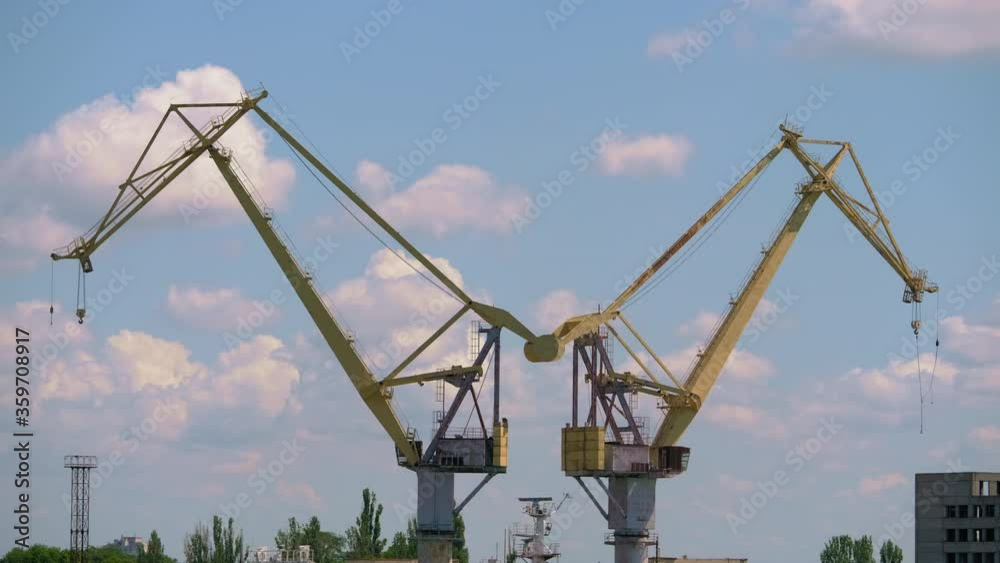 custom made wallpaper toronto digitalA plant with large cranes on a background of clouds. Modern cranes for shipbuilding