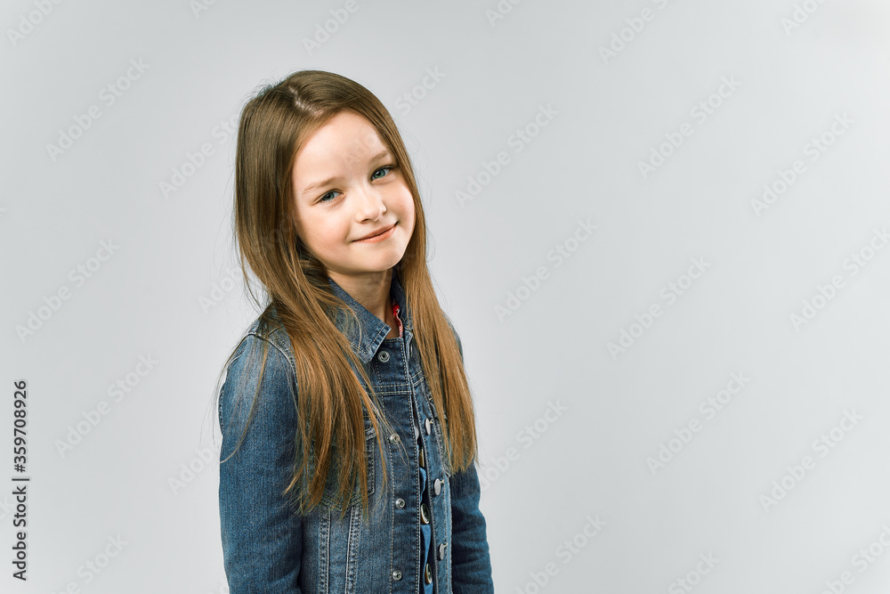 portrait of a cute little girl. gray studio background portrait of a cute little girl. gray studio background