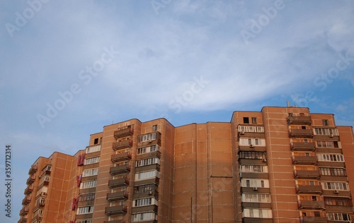 apartment building with blue sky