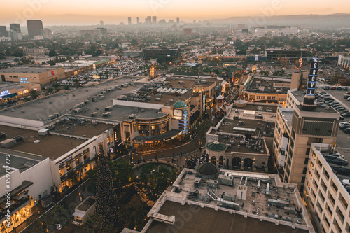 The Grove Shopping Center in Los Angeles at Sunset with Shops and Hollywood Skyline in the distance