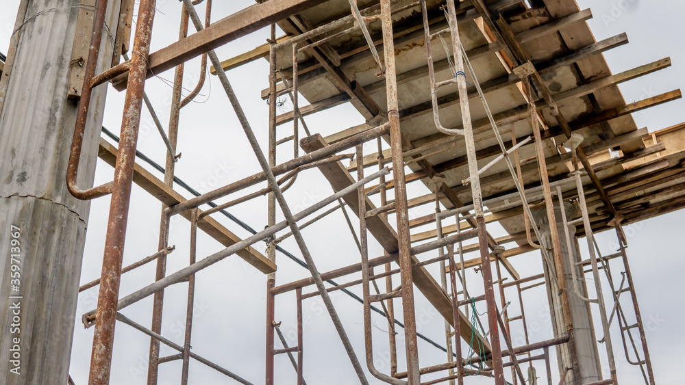 Close up view of scaffolding at the construction site. Building wall for house renovation. Close up view of scaffolding at the construction site. Building wall for house renovation.