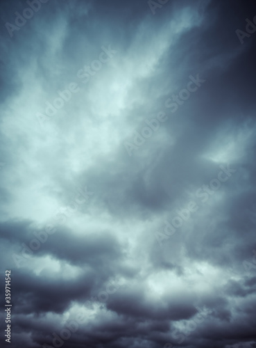 Soft blue and white sky with whisps of gray clouds cover the dramatic sky.  © Thorin Wolfheart