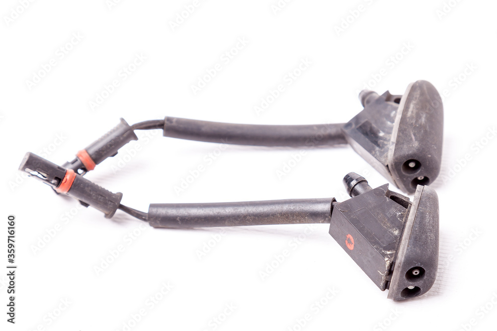Sale of spare parts during auto-analysis or car repair after an accident and breakdown in service on a white isolated background in a photo studio - a pair of windshield washer nozzles. Sale of spare parts during auto-analysis or car repair after an accident and breakdown in service on a white isolated background in a photo studio - a pair of windshield washer nozzles.