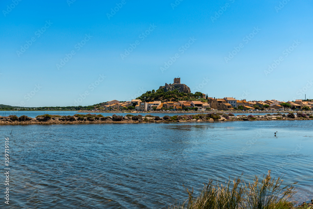 Old town of Gruissan and its Barbarossa tower and its ponds, in the south of France in Occitanie.