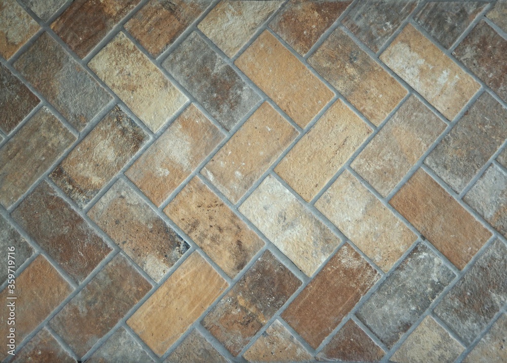 Rustic tile floor made of bricks. Old style effect for interiors with different shades of brown. Rustic tile floor made of bricks. Old style effect for interiors with different shades of brown.