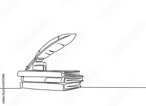 One continuous line drawing of stack of books, ink and quill pen on the office desk. Vintage writing equipment concept single line draw design vector illustration photo