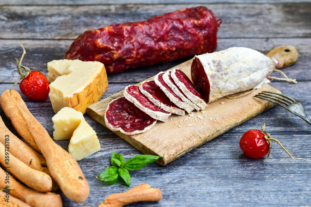 Italian dried salami and parmesan cheese Italian dried salami and parmesan cheese