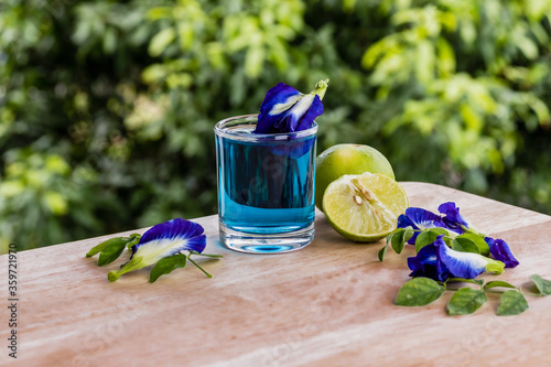 Butterfly Pea Flower juice  on  natural wooden table