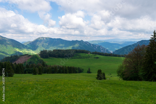 panoramic view of nice green hill on blue sky background 