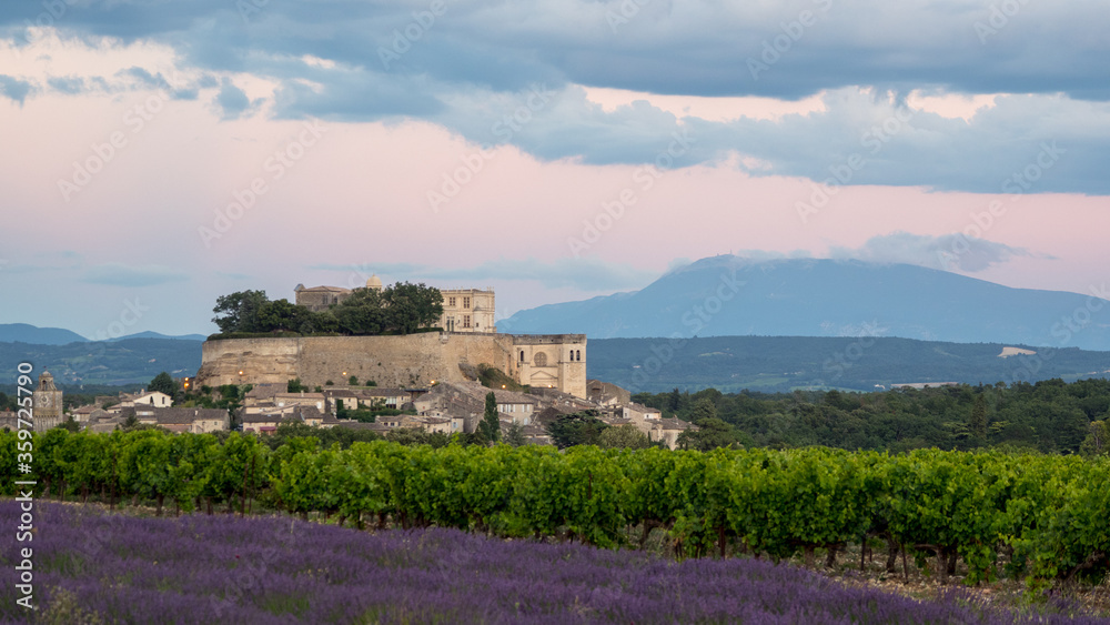 Château de Grignan on a backdrop of lavender fields in Provence
