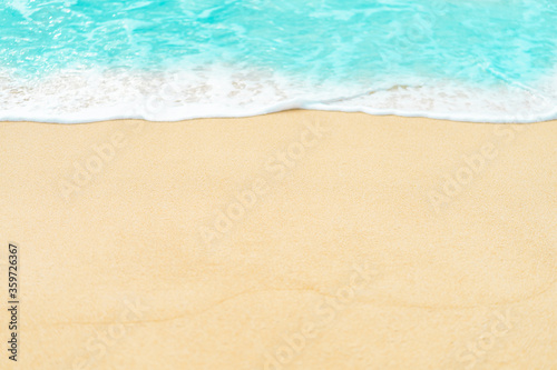 close up sand beach with blue sea wave background