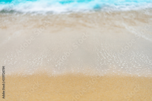 close up sand beach with blue sea wave background