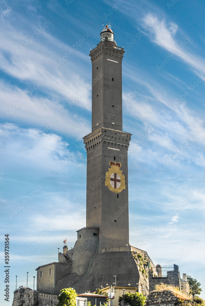 Lighthouse in the city of Genoa on a background of blue sky