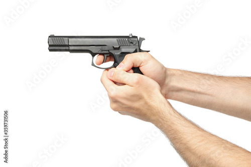 Male hands hold black pistol, isolated on white background