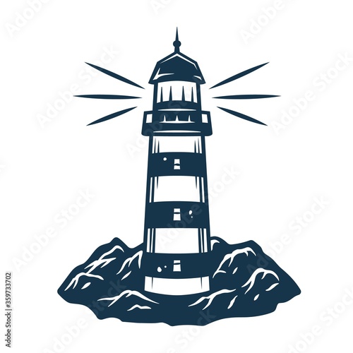 Sihluette of lighthouse by the sea on the rock