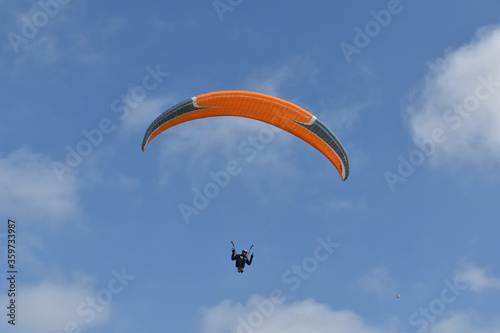 Paragliding at the beach of Katwijk aan Zee. Paraglider's making use of updraft of the dunes to stay in the air 