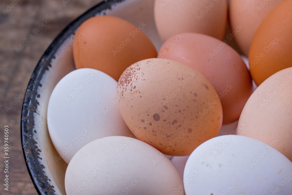 different colored eggs on an old tray - closeup different colored eggs on an old tray - closeup