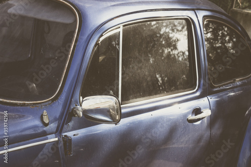 Old blue classic car with vintage style view. Retro automobile concept.