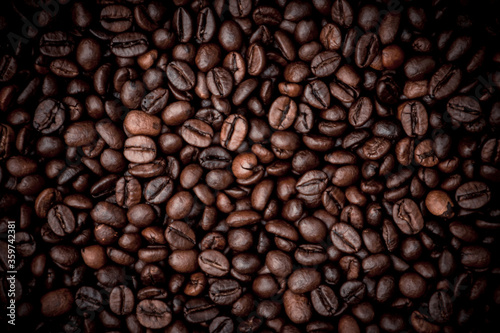 a heap of black coffee beans © Denis