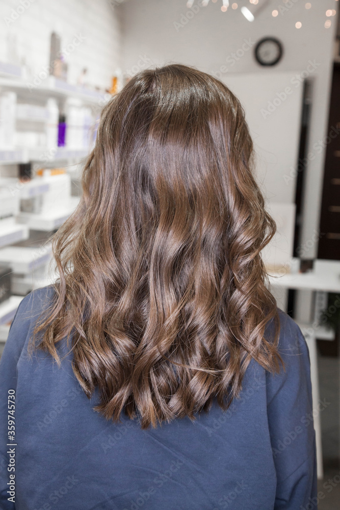 Beautiful Slavic hair on the model after care and restoration procedures in a beauty salon Beautiful Slavic hair on the model after care and restoration procedures in a beauty salon