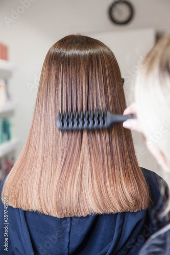 Beautiful Slavic hair on the model after care and restoration procedures in a beauty salon