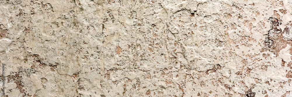 Texture of a concrete wall with cracks and scratches which can be used as a background Texture of a concrete wall with cracks and scratches which can be used as a background