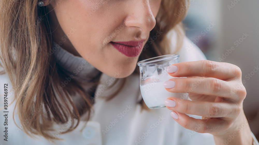 Female Pharmacist Testing Cream Scent in Laboratory Female Pharmacist Testing Cream Scent in Laboratory