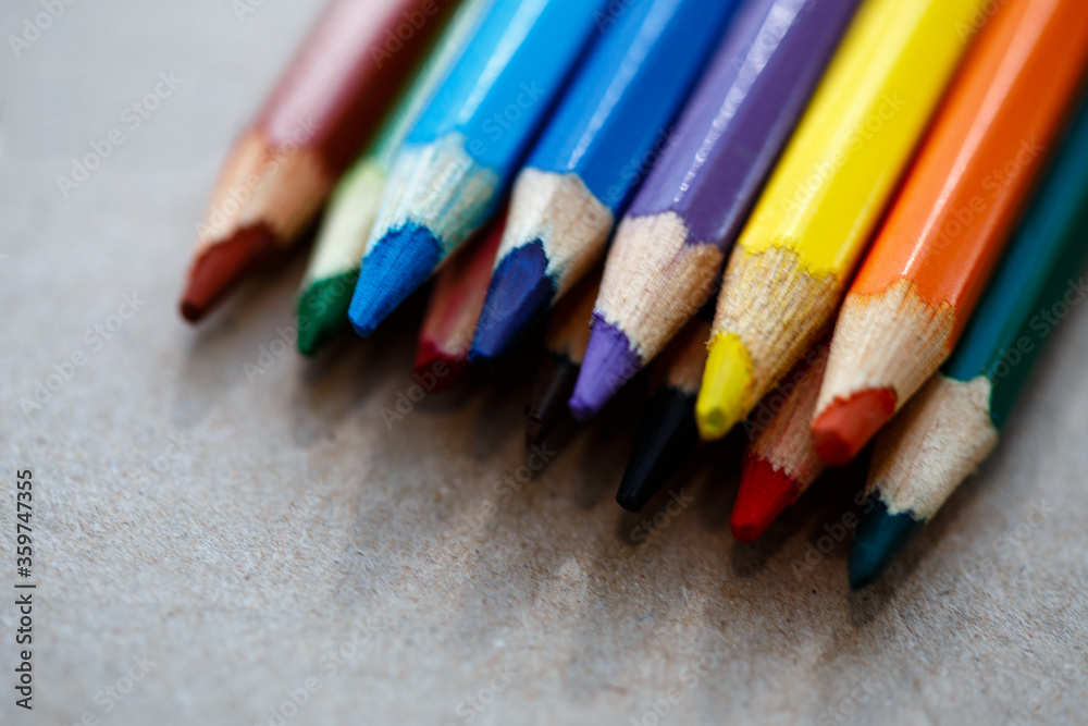 color pencils on a piece of paper on a light background color pencils on a piece of paper on a light background
