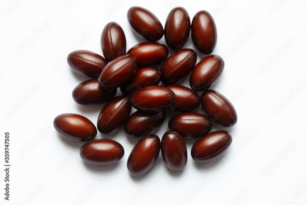 handful of vitamins for the heart on a light background handful of vitamins for the heart on a light background