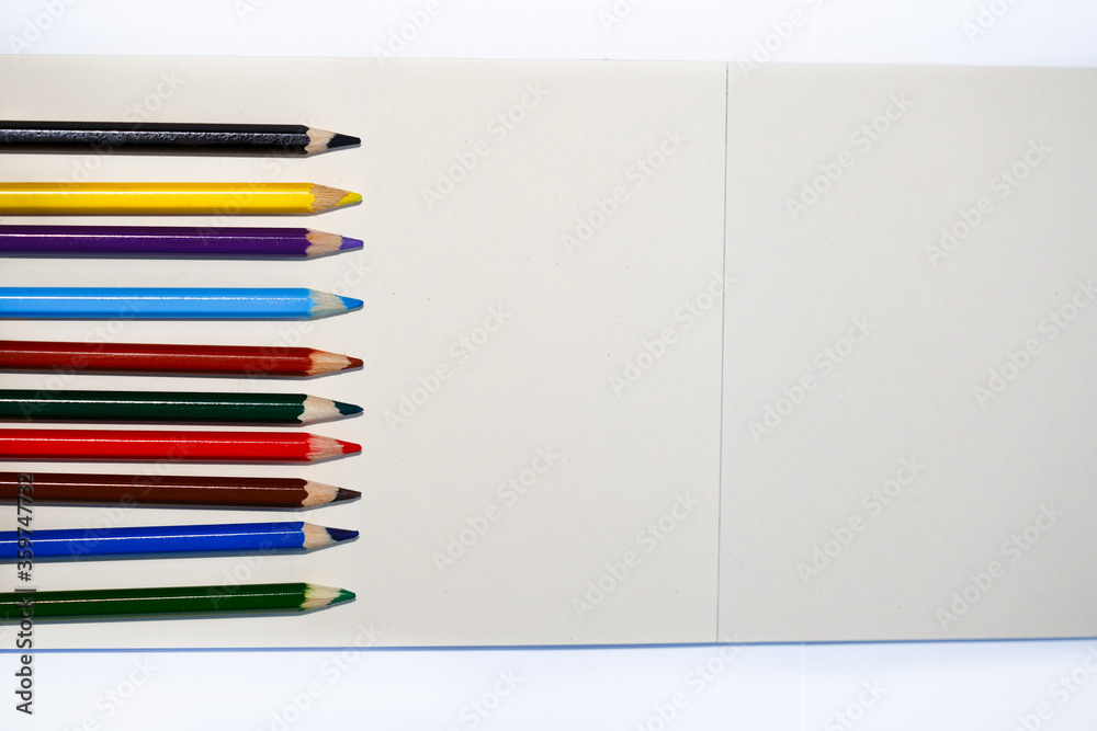 light background with bright colored pencils light background with bright colored pencils