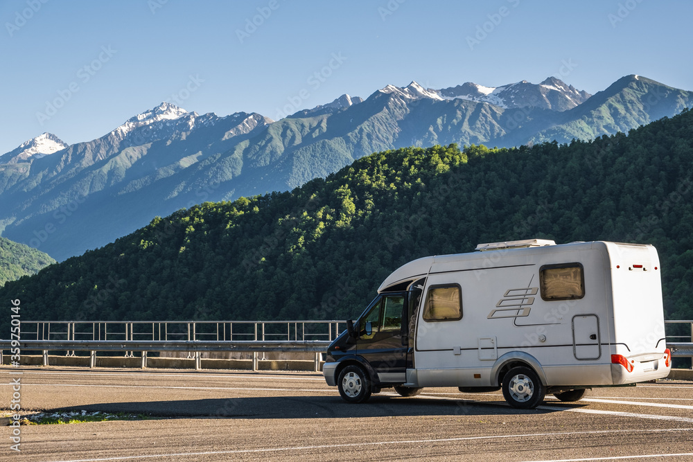 A motor home. A house on wheels. Camper. Rest in the mountains. Rv. Travelling by car. A trip to the mountains. Auto house.