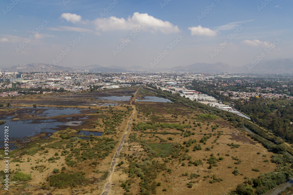 Aerial view of water regulation pond in the urban area of Mexico City