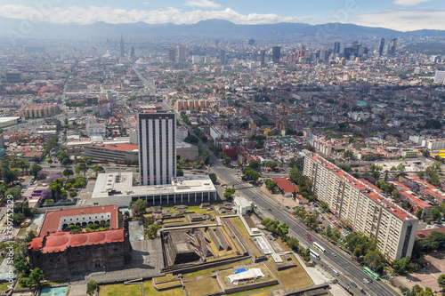 Aerial view of Mexico City with three culture site: a colonial church, ancient ruins, and modern building, in downtown Tlatelolco apartment living area photo