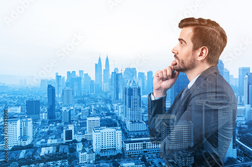 Photography Young handsome businessman in suit with hand on chin thinking how to succeed, new career opportunities, MBA