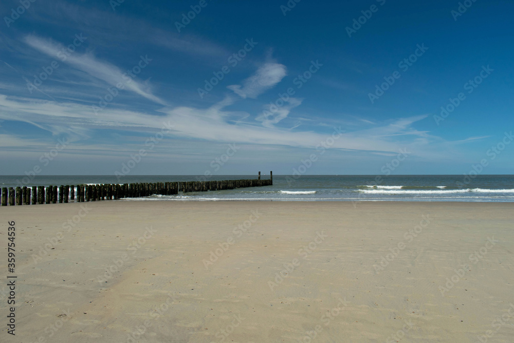 wooden groynes at the beach in Zeeland, Holland wooden groynes at the beach in Zeeland, Holland