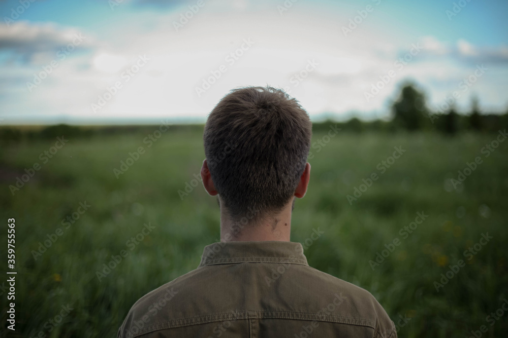 Man standing in wheat field. Horizontally framed shot. Man standing in wheat field. Horizontally framed shot.