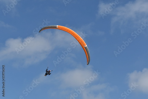 Paragliding at the beach of Katwijk aan Zee. Paraglider's making use of updraft of the dunes to stay in the air