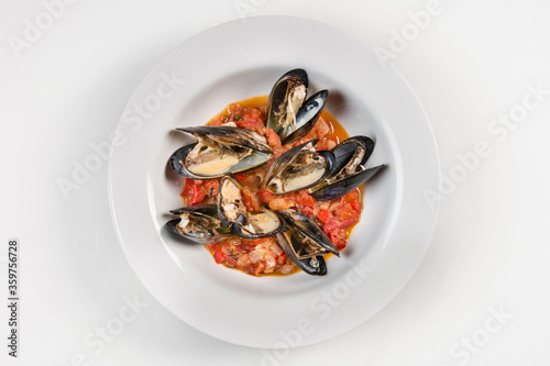 Mussels plate with tasty tomato sauce Wine and tomato recipe used in this mussel seafood plate