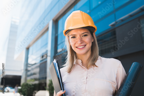 Wallpaper Mural Professional architect woman standing outdoors. Torontodigital.ca