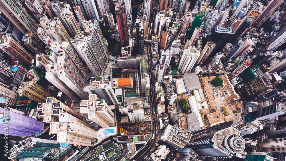 Top view aerial photo from flying drone of a Hong Kong Global City with advanced buildings, transportation, energy power infrastructure. Financial and business centers in developed China town