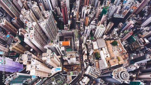 Top view aerial photo from flying drone of a Hong Kong Global City with advanced buildings, transportation, energy power infrastructure. Financial and business centers in developed China town © BullRun